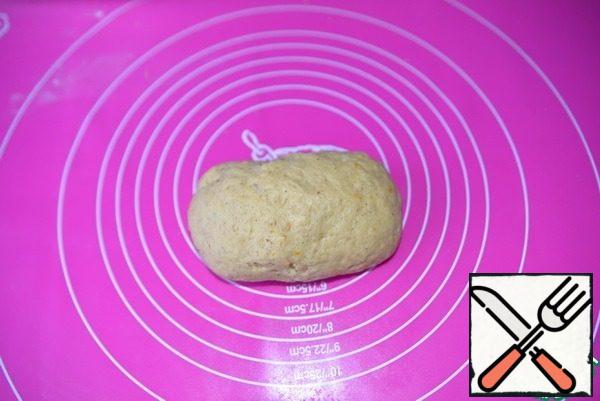 Flour can be left more or less, the dough should be soft, elastic. Put the dough in a bag and send it to the refrigerator for 30 minutes.