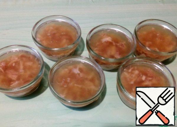 Arrange the meat into portions and pour over the broth. If desired, you can add various products to it. Under a layer of transparent jelly, they will turn into a spectacular decoration. The portioned aspic from chicken looks especially great. But do not add such products to the classic jelly. Put the aspic in the refrigerator to solidify. If there is still broth left, you can pour it over any vegetables, meat or fish. Sorry about the night photo, it didn't want to turn out. The volume of cans is 130 ml.
