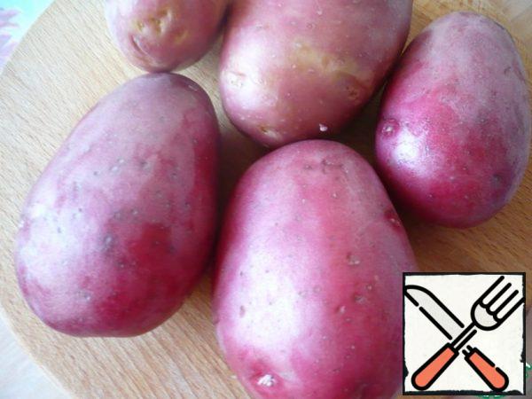 For cooking, I took red potatoes. Peel and wash the potatoes.