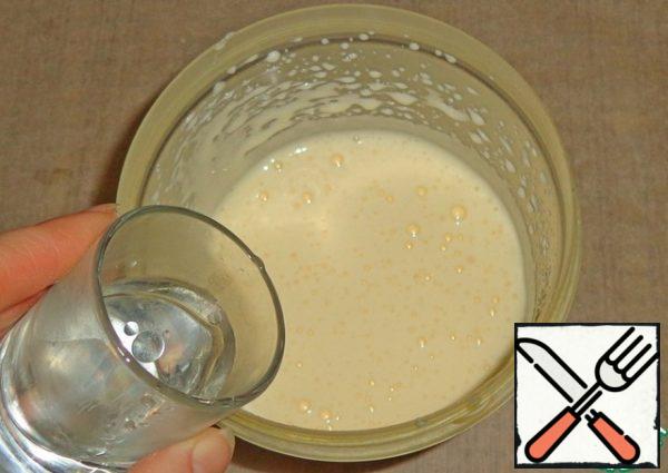 Add boiling water, mix with a spatula until smooth.