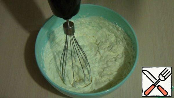 To make the cream snow-white, first whisk the soft butter with powdered sugar until you get a white and fluffy mass. Then add cheese and sour cream to it, as well as vanilla. Mix well and whisk until a thick cream is obtained. Before assembling the cake, it is better to put the cream in the refrigerator for at least half an hour.