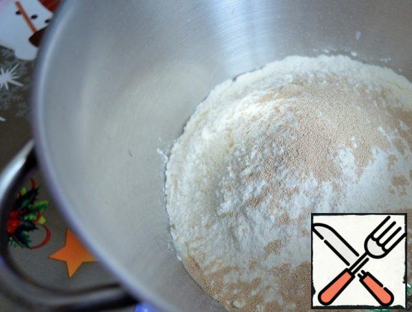 Add the sifted flour, sugar and yeast.