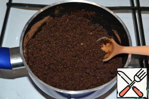 Remove from the heat and pour in the cocoa-sugar mixture, stir to make a crumb.