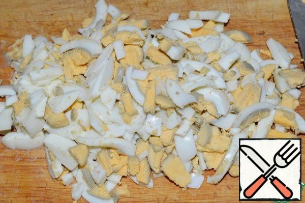 Boil the eggs and also cut into strips.