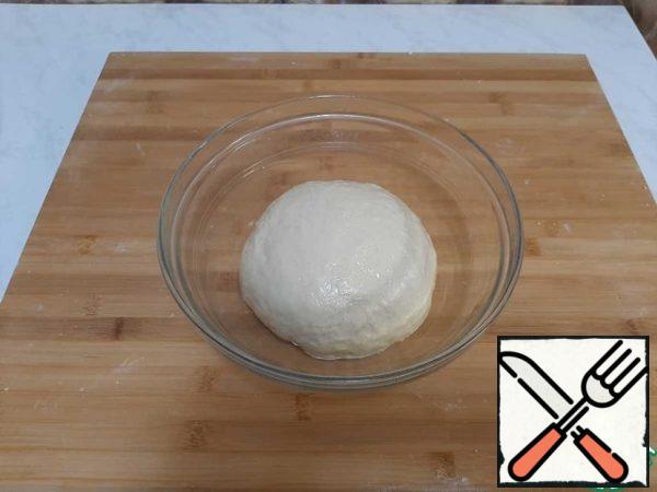 Make dough. Leave in a warm place to rise for 1 hour.