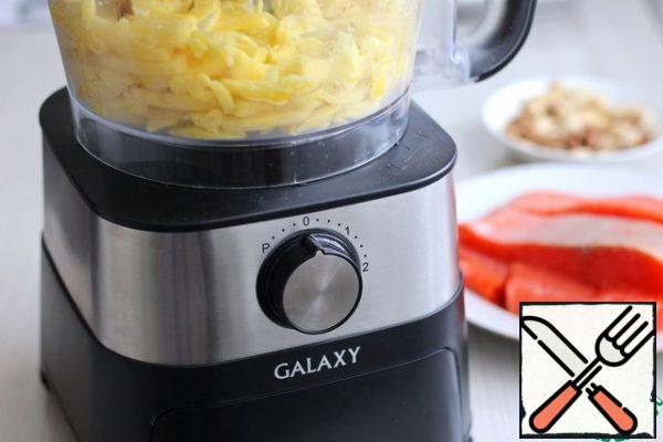 French fries can be served as a side dish to fish. A food processor will help us cut potatoes into cubes.