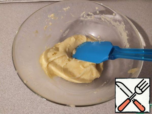 Beat the eggs lightly with a fork. Gradually add to the dough, carefully kneading it with a spatula until smooth. The finished dough turns out to be viscous and does not spread.