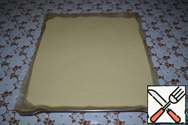 Pour the dough on a baking sheet and flatten.