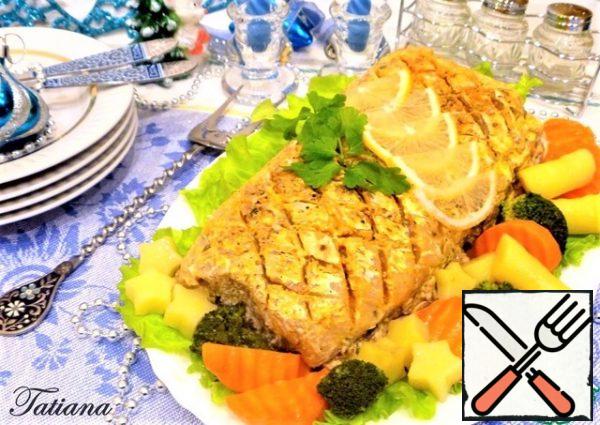 Remove the finished fish from the oven. Slice into portions. Serve with steamed vegetables.