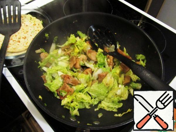Add the cabbage and hot pepper to the pan. Fry for another 2-3 minutes.