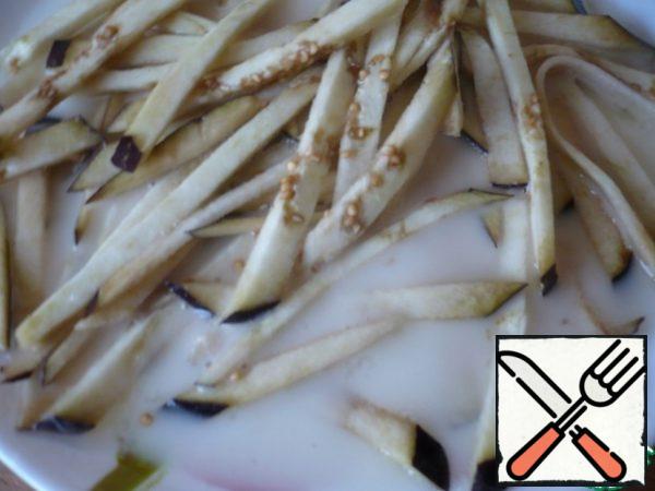 Dip the chopped eggplant into the prepared mixture.