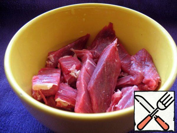 Cut the beef into strips along the fibers.