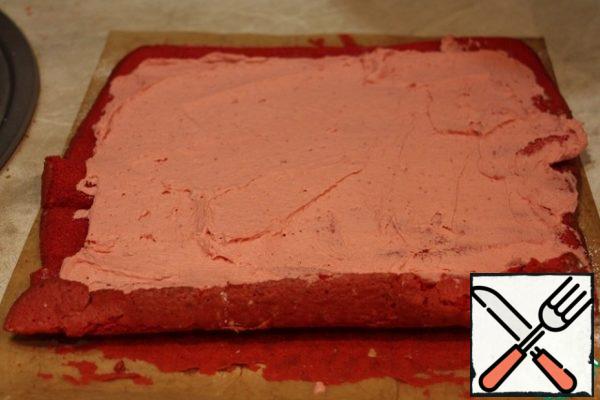 Unwrap the roll and spread with strawberry ganache.