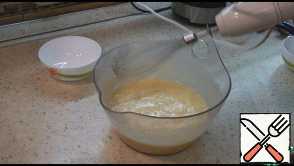 Add the milk, sunflower oil, lemon zest, flour and baking powder and mix everything well again.
