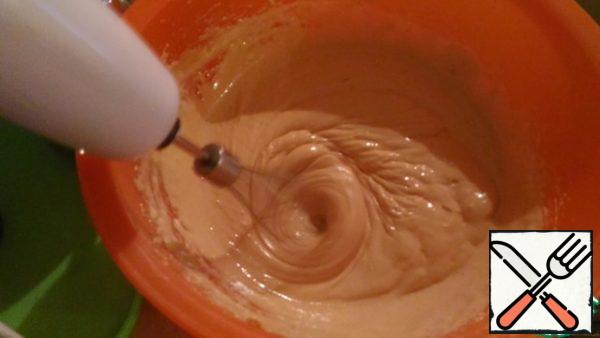 While the dough cools, prepare the cream. To do this, mix the condensed milk with a mixer with sour cream (not liquid; you can weigh it through 2-3 layers of gauze for 1-2 hours)until smooth. And also send it to the refrigerator.