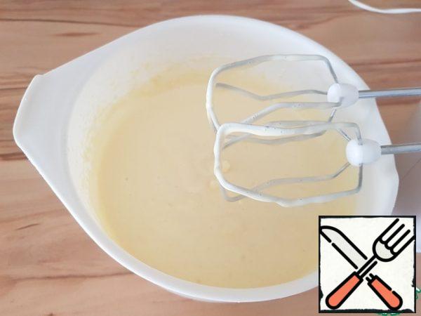 Mix the flour with baking powder. Using a mixer, mix in the egg mixture.
Add the yogurt and mix well.