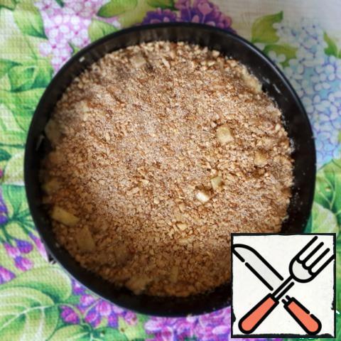 Pour on the pie nut crumbs, gently press it down.