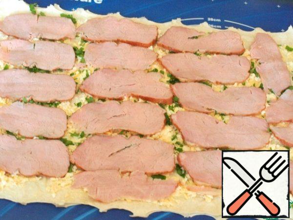 Thinly slice the ham and lay it on top.