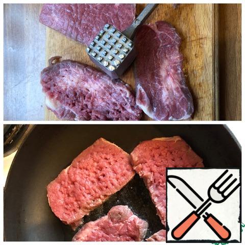 Cut the meat into steaks and chop it off on both sides. Fry in a well-heated pan on both sides in vegetable oil, just a couple of minutes on each side.