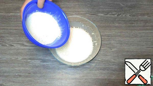 Add flour and baking powder, beat with a mixer until smooth.