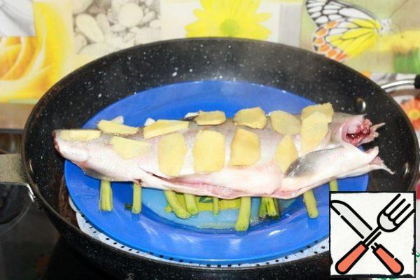 Put the fish dish in a steamer, where the water should already boil.