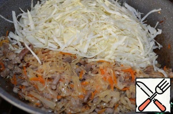 Chop the fresh cabbage thinly, RUB it lightly with your hands,
add to the pan. Mix and simmer under the lid until ready.
