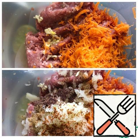 Add salt to the minced meat, garlic passed through the press, and grate the Carrots on a fine grater. Add all the spices and grate the onion on a coarse grater. Carefully knead the minced meat.