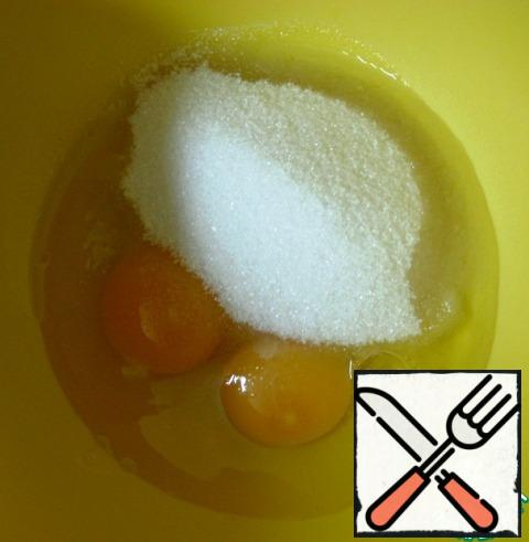 RUB the eggs with sugar.
