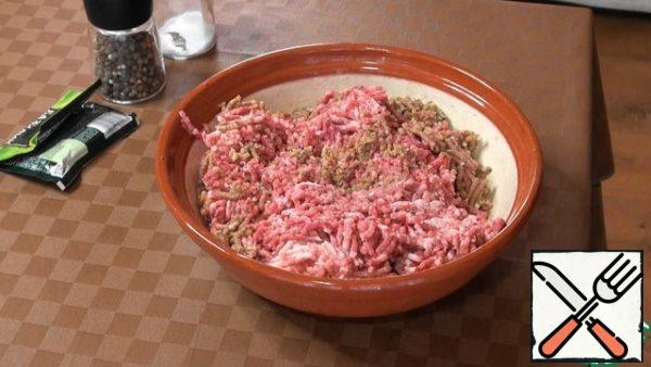 Pass pork, fat and walnuts through a meat grinder.