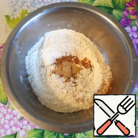 Sift the flour, add baking powder and spices.