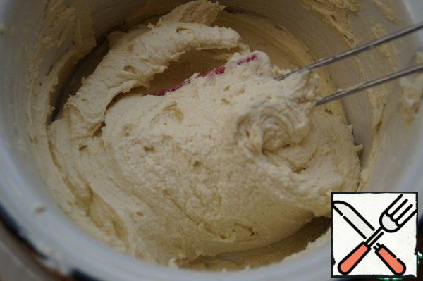 Add 130 grams of flour and starch, beat. Add another 130 grams of flour and mix until smooth with a spatula. The dough turns out to be lush.