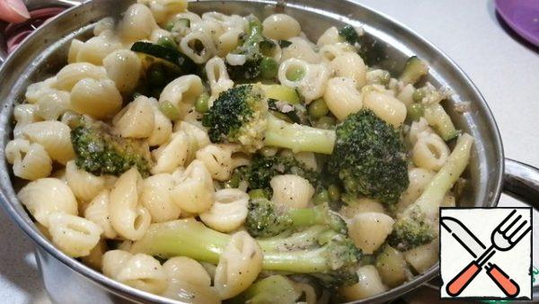 Add the vegetables and anchovies to the pasta and mix.