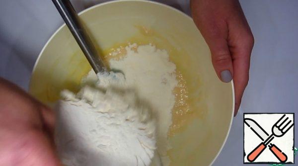 Add the egg, salt and melted butter. Gradually add the flour and knead a smooth, non-sticky dough.
