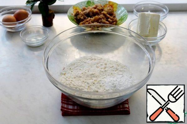 Sift the flour, add baking powder, salt and vanilla extract.