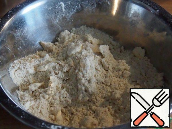 With your fingers to make crumbs. Add water and knead the dough. Wrap the dough in cellophane and put it in the refrigerator.