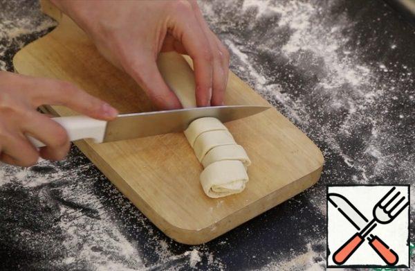 Cut into slices about 1 cm thick .