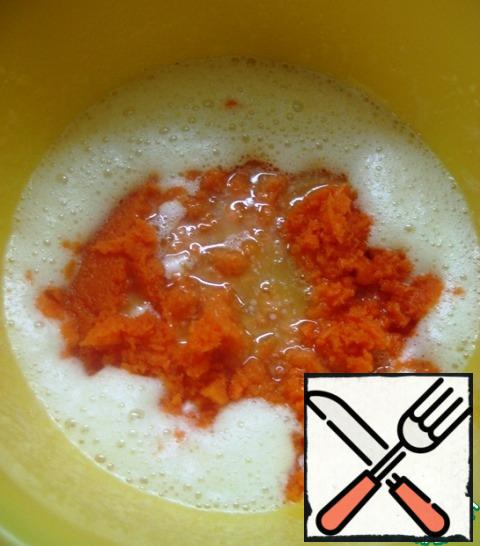 Add the pre-melted and cooled butter and carrot puree.