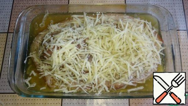 Sprinkle the meat with grated cheese and send it to the oven for another 20 minutes.
