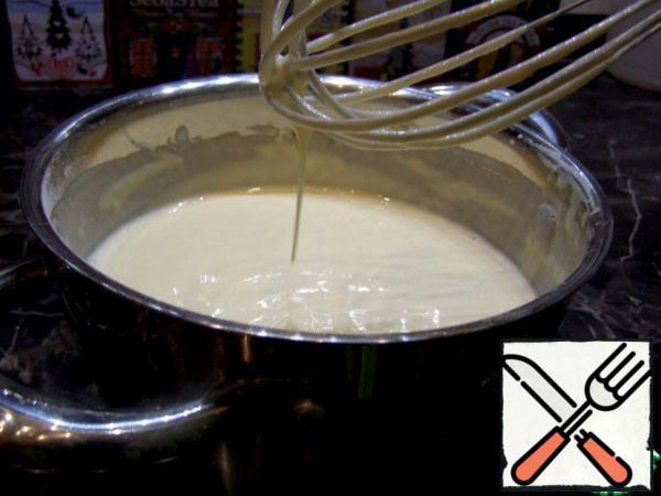 For this recipe, pancakes can be any (from wheat flour and milk), because the" highlight " of the recipe is not pancakes at all, but the filling and sauce. You can make pancakes according to your own recipe or try mine. Mix the egg with milk and kefir, add salt, sugar and flour, and mix until smooth. Add baking soda and odorless vegetable oil. Now you can fry pancakes without greasing the pan every time.