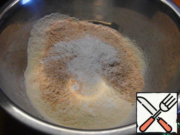 Sift the flour with baking powder, add whole-grain flour and salt.