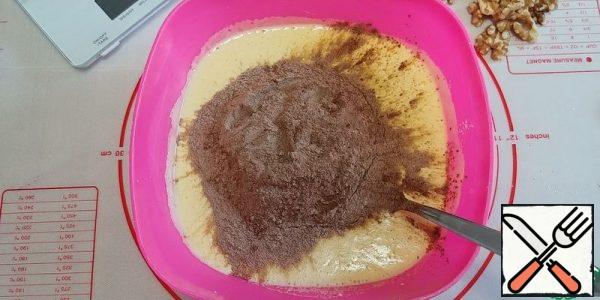 Mix cocoa with flour and baking powder, add to the mixture.