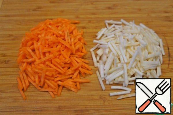 Carrot, parsley root (celery) and onion cut into thin strips.