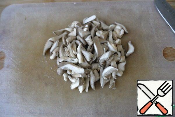 Mushrooms are washed, dried, cut into strips, I have oyster mushrooms.