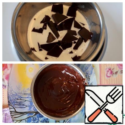 Prepare the ganache. Heat the cream to about 70 degrees, add the chocolate pieces, and stir.