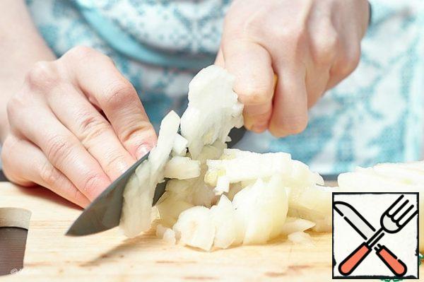 Cut the onion into the same cubes. Add it to the carrots.