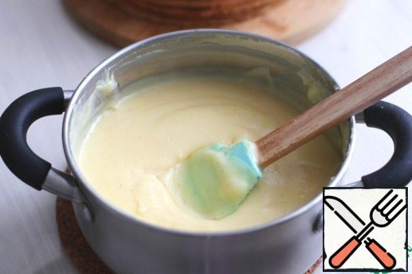 Cream:In a bowl, beat the egg yolks (5 PCs.), add milk (500 ml.), add melted butter (cool to room temperature), add flour (50 gr.), add 150 gr. sugar, add 1 tsp. vanilla sugar. Beat the mixture and put it on medium heat, bring the mixture to a boil, then reduce the heat to a minimum and with constant stirring, boil the cream until thick.
Then cover the cream with cling film and cool to room temperature. To speed up the process, you can take the cream out into the cold.
Next, grease the cakes with the prepared cream, sprinkle with the prepared crumbs, and decorate the cake to taste. This recipe used shavings of a mixture of milk and white chocolate.