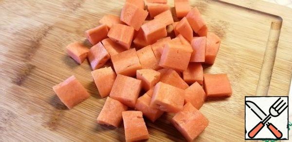 Cut the carrots into large cubes. Add to the pot. Cook for 5 minutes.