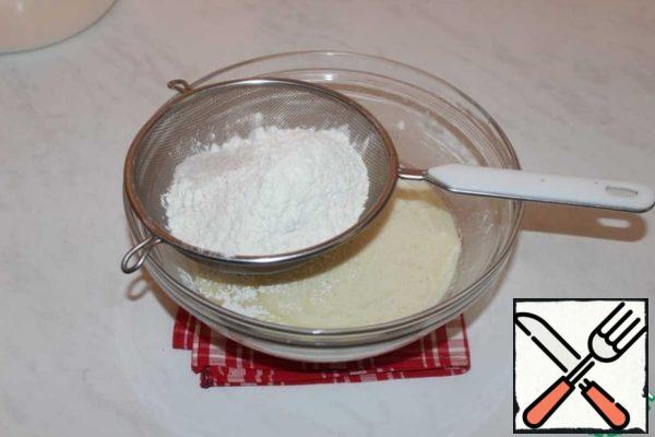 Gradually add the sifted flour.