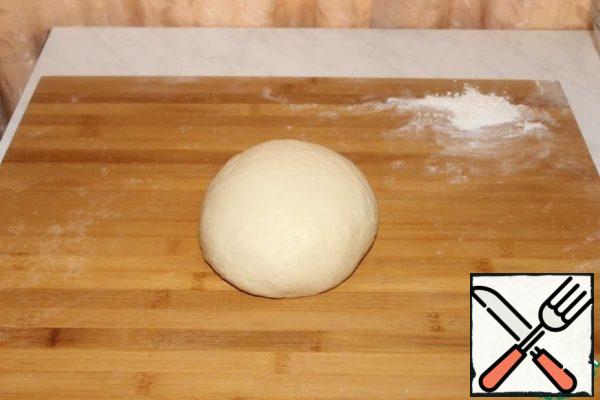 Knead a smooth, homogeneous dough. Transfer the dough to a greased bowl and leave in a warm place to rise for 1 hour.