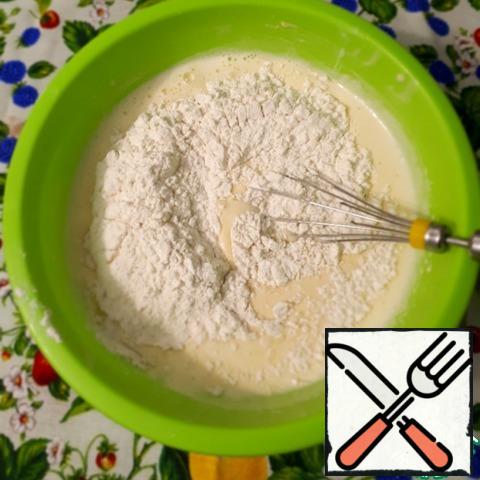 Sift the flour with baking powder. Add the flour to the beaten mass and knead the dough.